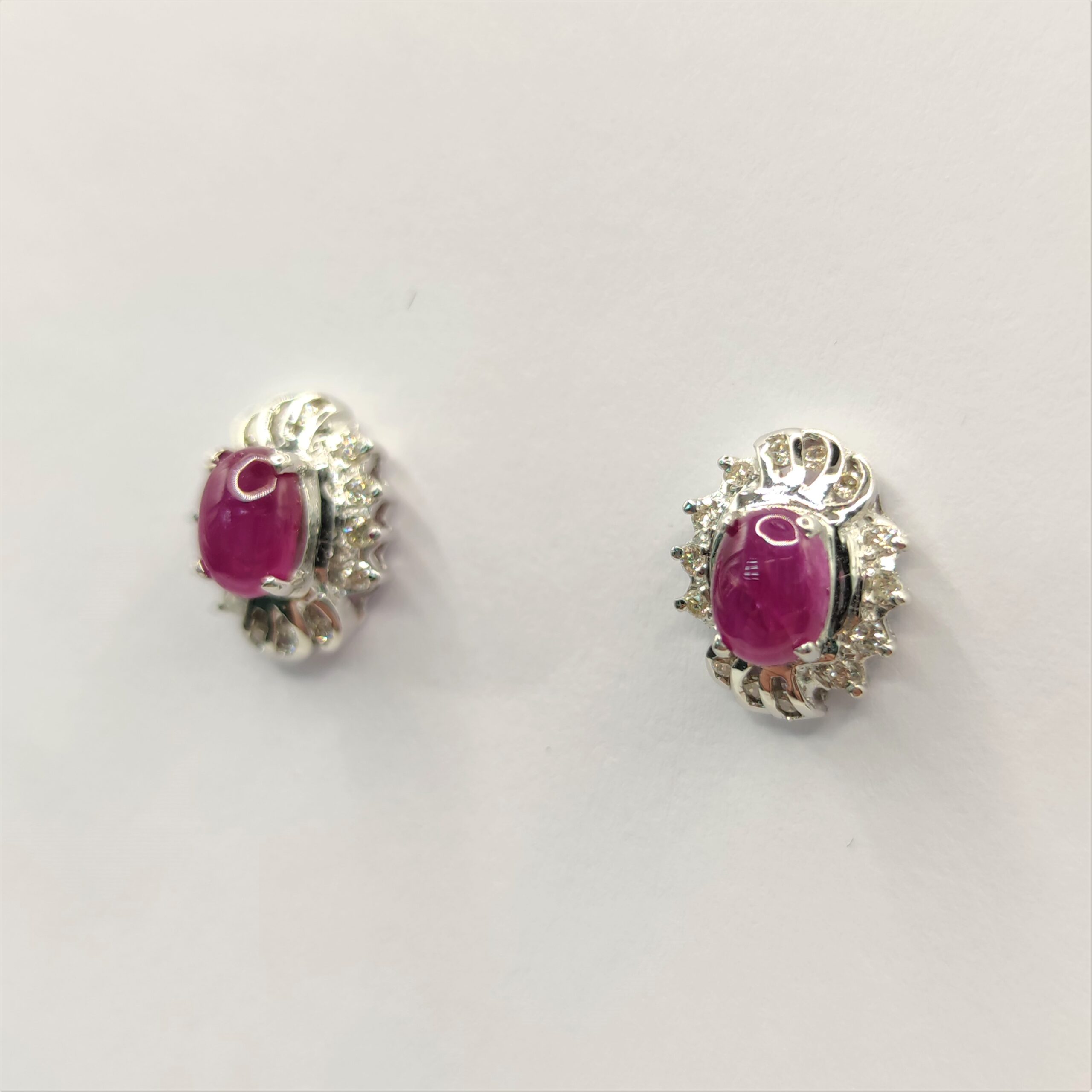 Sold at Auction: 18Kt Cabochon Ruby & Diamond Flower Earrings